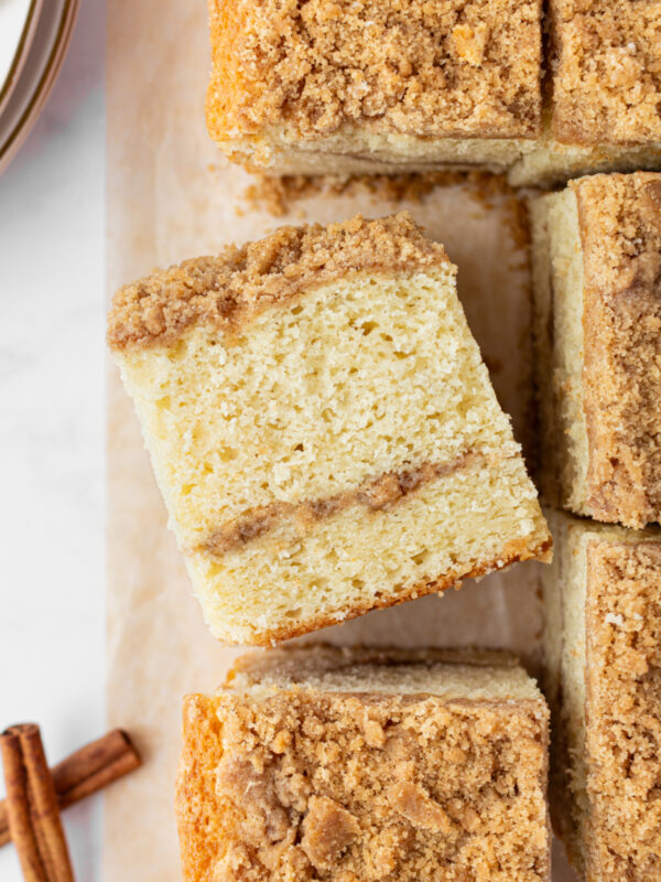 slices of copycat starbucks cinnamon coffee cake with one sitting on its side