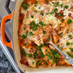 peek at half a dish of stuffed shells just out of the oven