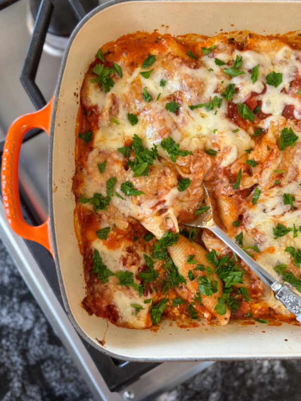 peek at half a dish of stuffed shells just out of the oven