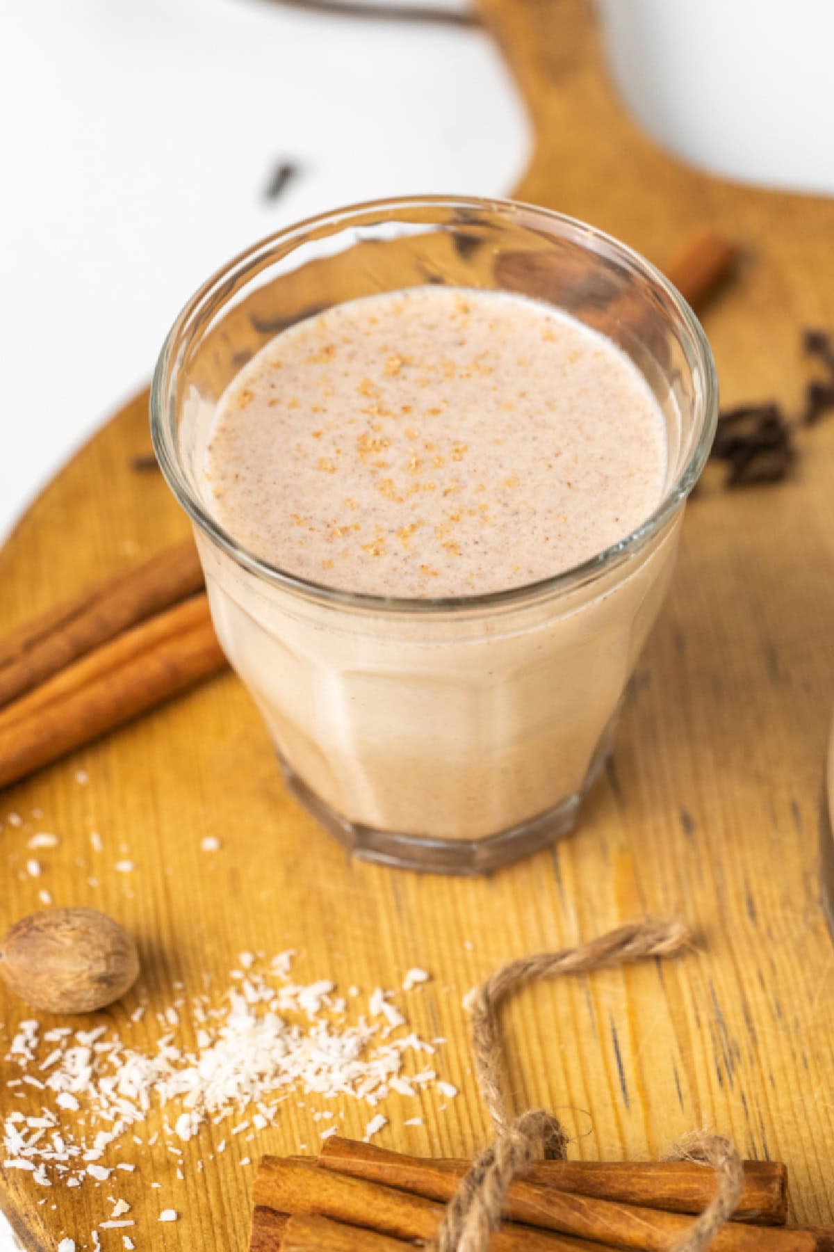 This easy, authentic Puerto Rican Coquito is rich, creamy, spiced, and perfect for Christmas! Made with coconut milk, sweetened condensed milk, and rum — just blend and chill. coquito in a glass