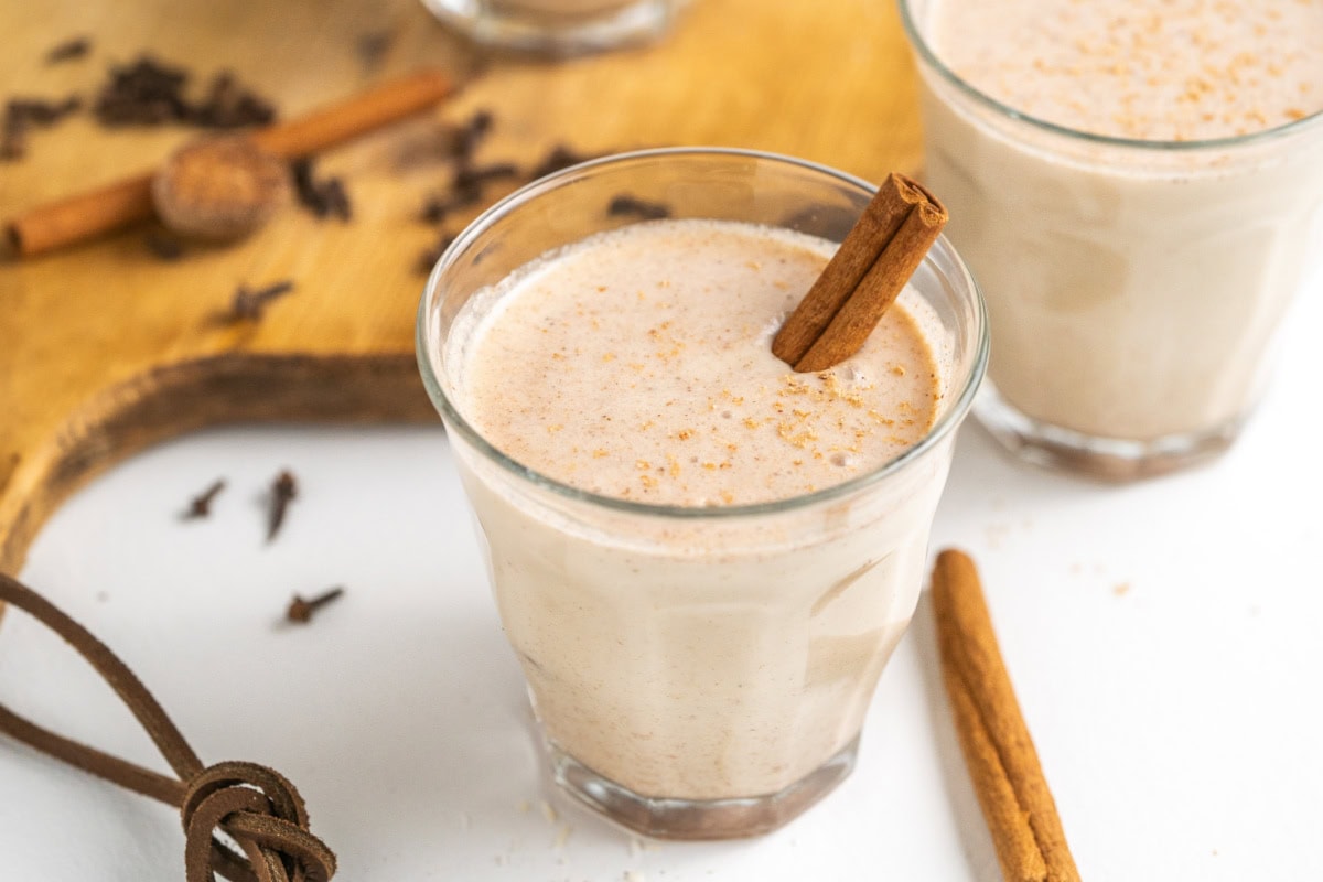 This easy, authentic Puerto Rican Coquito is rich, creamy, spiced, and perfect for Christmas! Made with coconut milk, sweetened condensed milk, and rum — just blend and chill. glass of puerto rican coquito