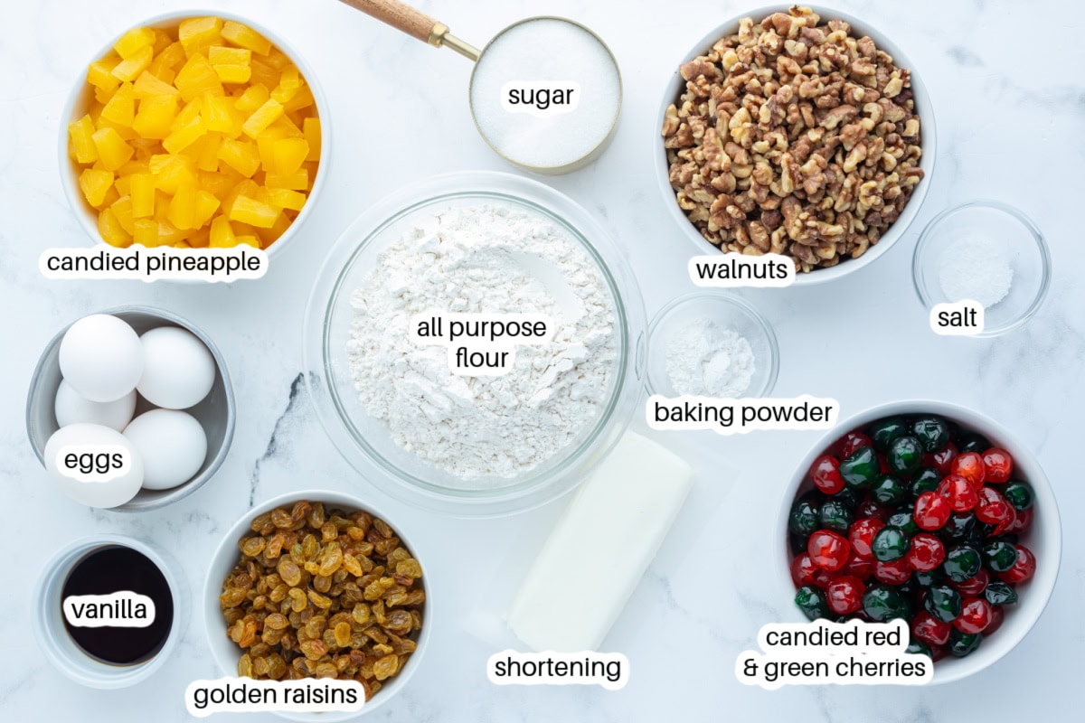 This homemade fruitcake is rich, moist, and loaded with candied fruit and nuts. A traditional Christmas dessert that bakes beautifully and slices perfectly every time. ingredients displayed for making fruitcake