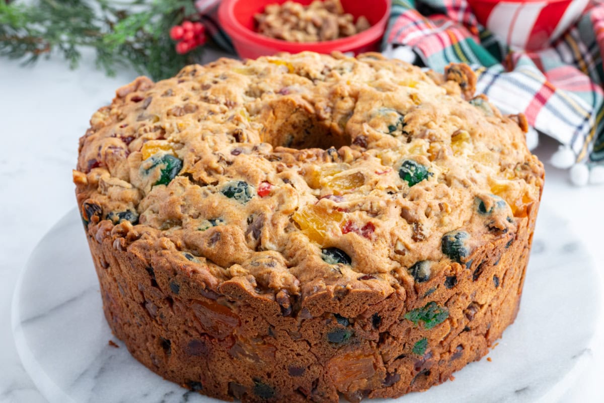 This homemade fruitcake is rich, moist, and loaded with candied fruit and nuts. A traditional Christmas dessert that bakes beautifully and slices perfectly every time. whole fruitcake
