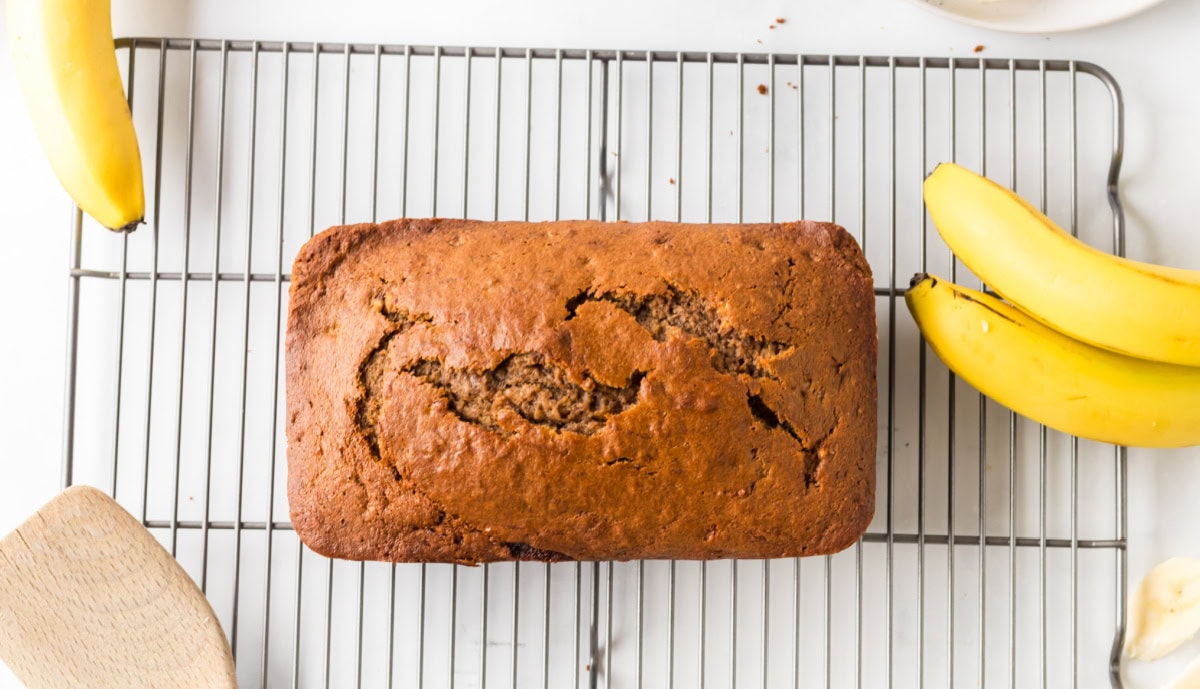 overhead shot of healthy banana bread on a cooling rack