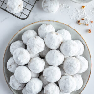 overhead shot of a plate of pfeffernusse cookies