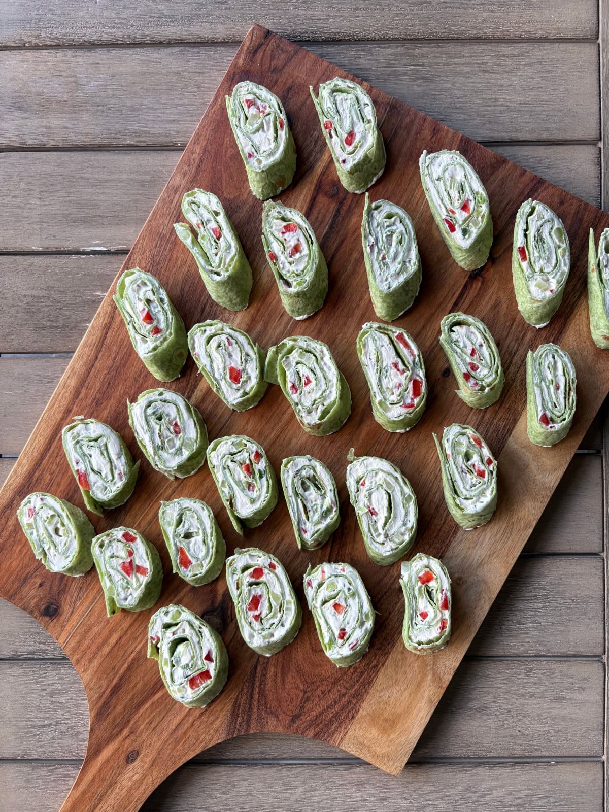 pinwheel appetizers on a serving board