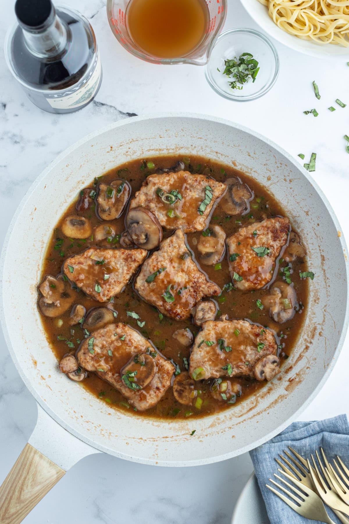 Tender pan-seared veal simmered in a glossy Marsala wine sauce with mushrooms and green onions. This easy Veal Marsala is elegant, flavorful, and perfect for entertaining or weeknight comfort food. veal marsala in a skillet