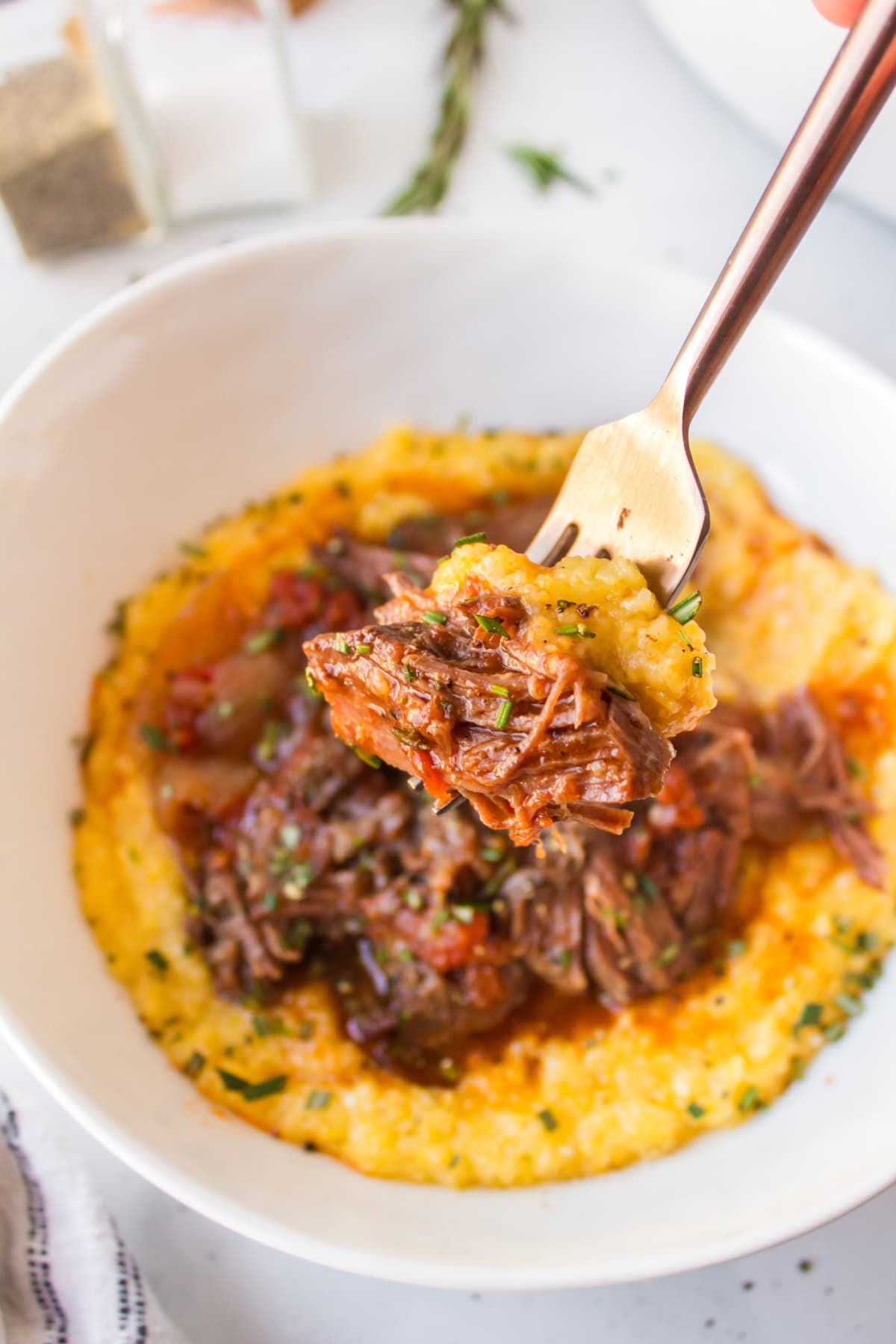 bite of slow cooker italian pot roast on a fork
