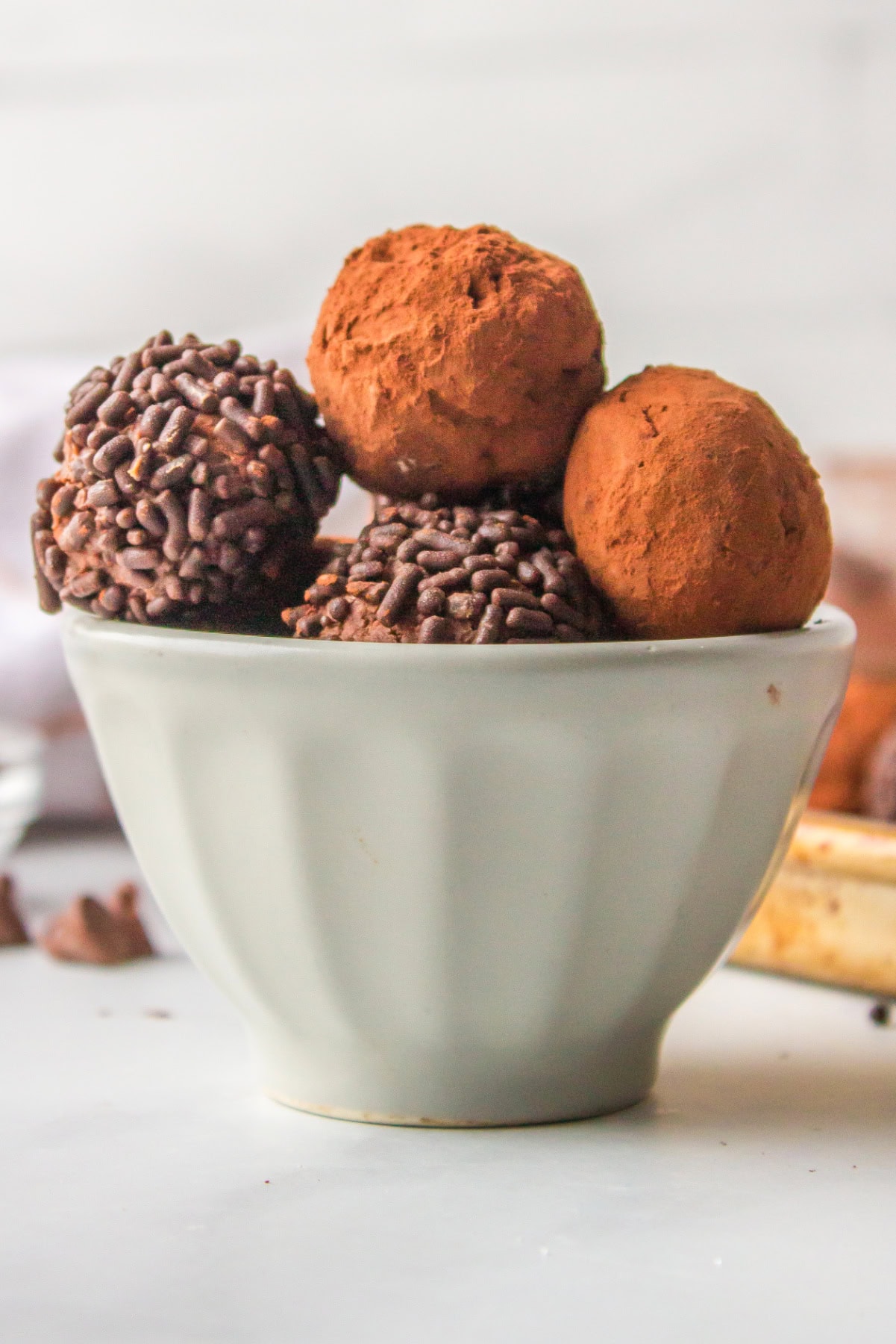 chocolate cocoa truffles in a white bowl