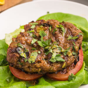 healthy turkey burger pattie served over lettuce and tomato