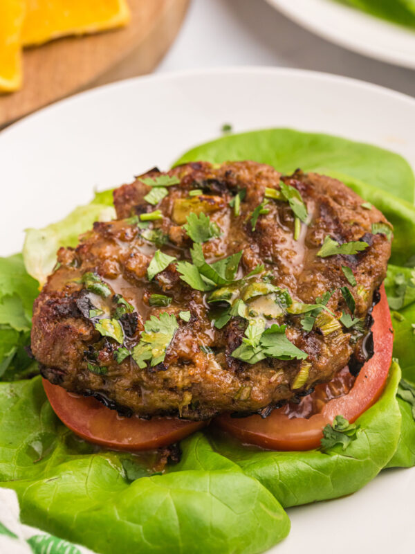 healthy turkey burger pattie served over lettuce and tomato