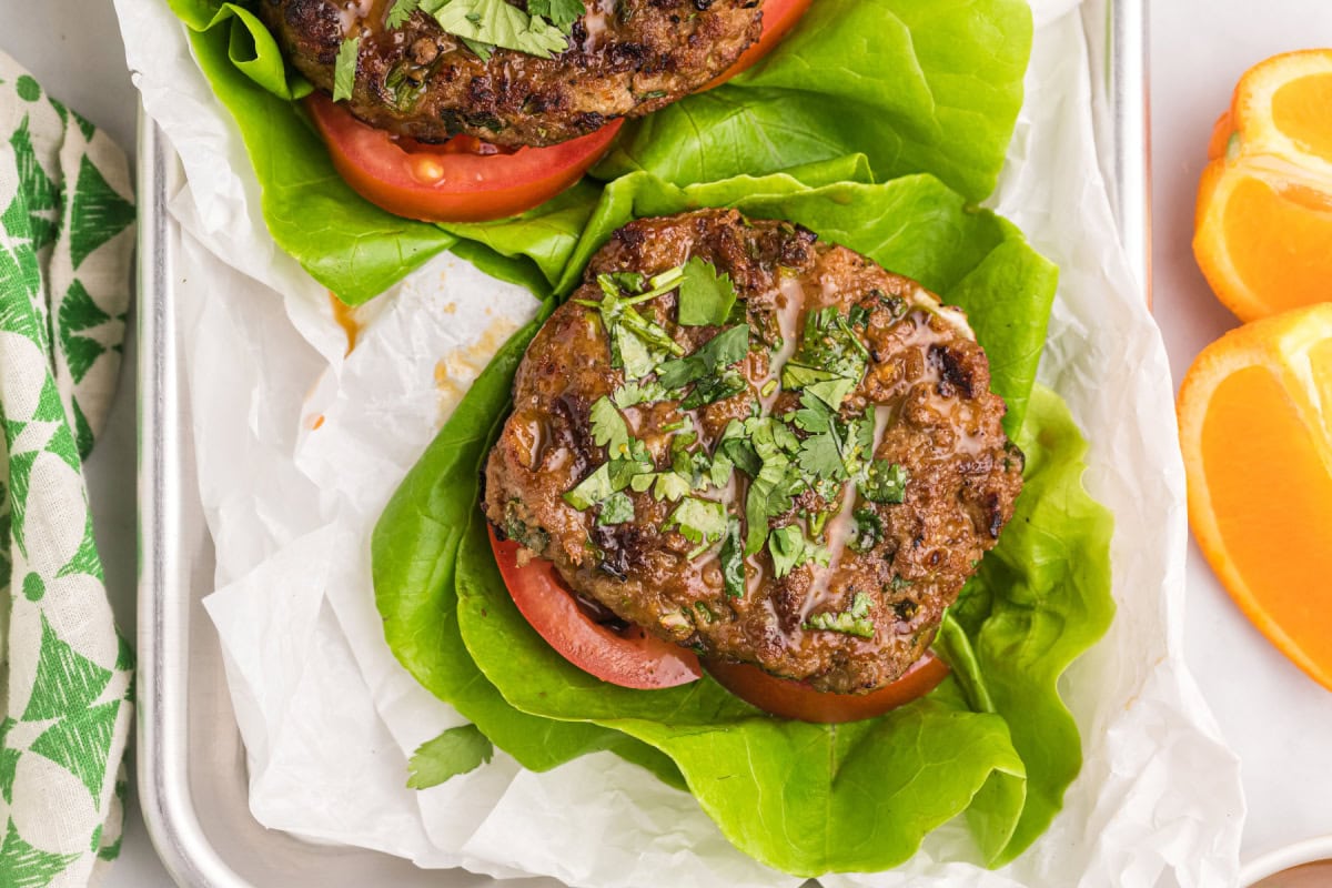 These Healthy Turkey Burgers with Orange Ginger Glaze are juicy, bright, and full of fresh flavor. Lean turkey meets a tangy homemade citrus glaze — perfect for easy dinners! healthy turkey burger pattie