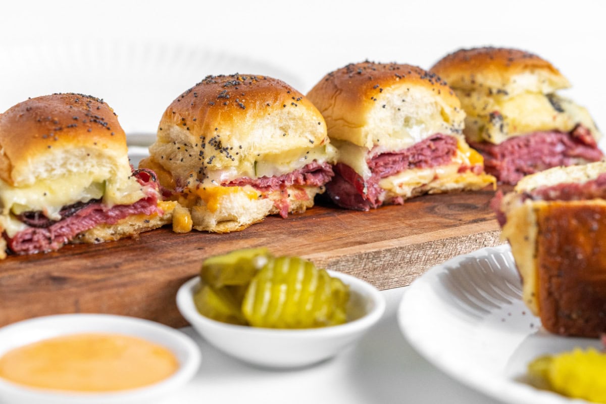 four pastrami sliders on board