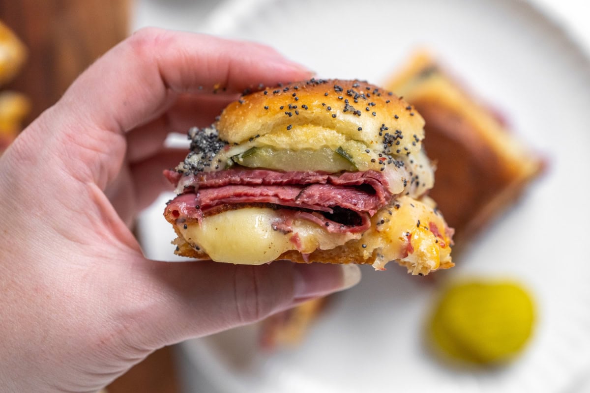 hand holding pastrami slider