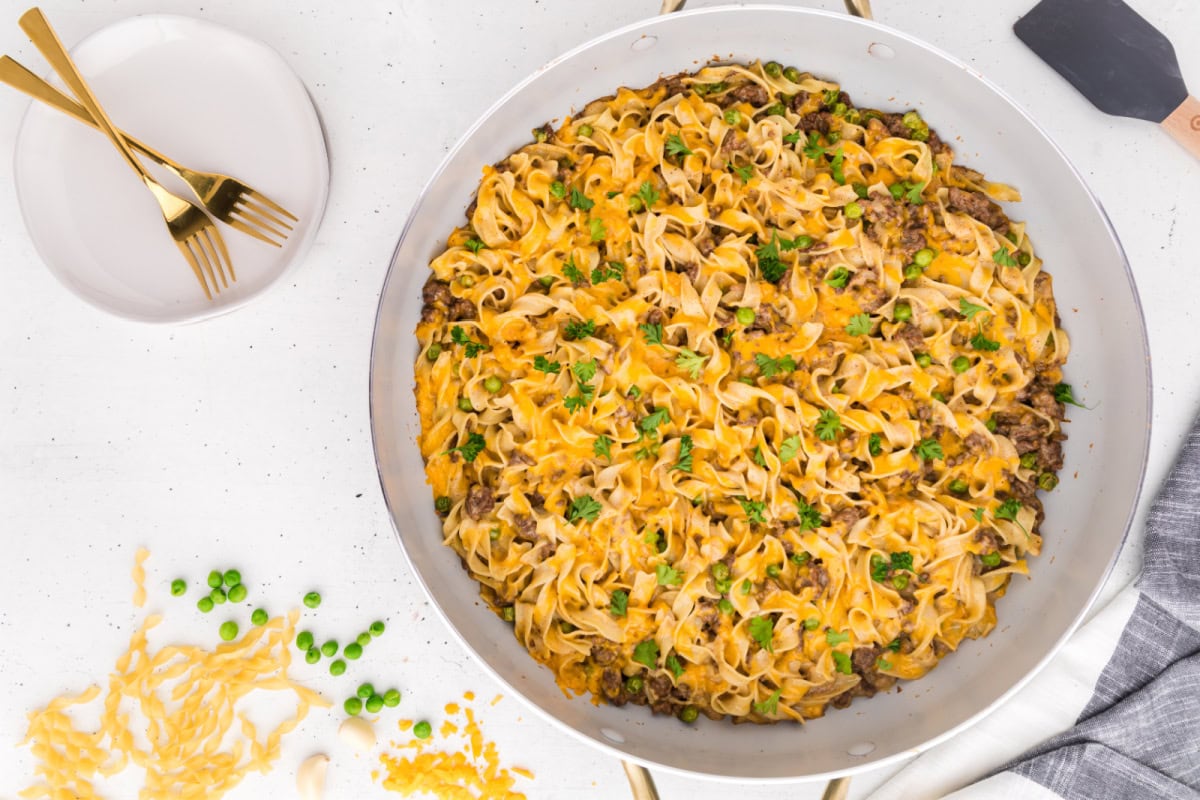 This Ground Beef Stroganoff is creamy, cheesy, and loaded with beef and noodles in a rich sauce. A cozy, easy dinner idea! ground beef stroganoff in skillet