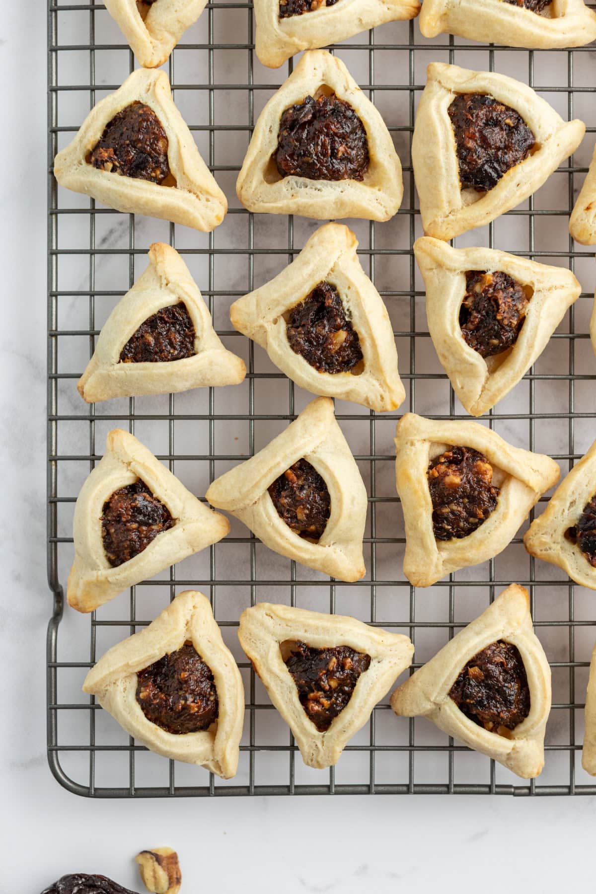 hamantaschen on a wire cooling rack
