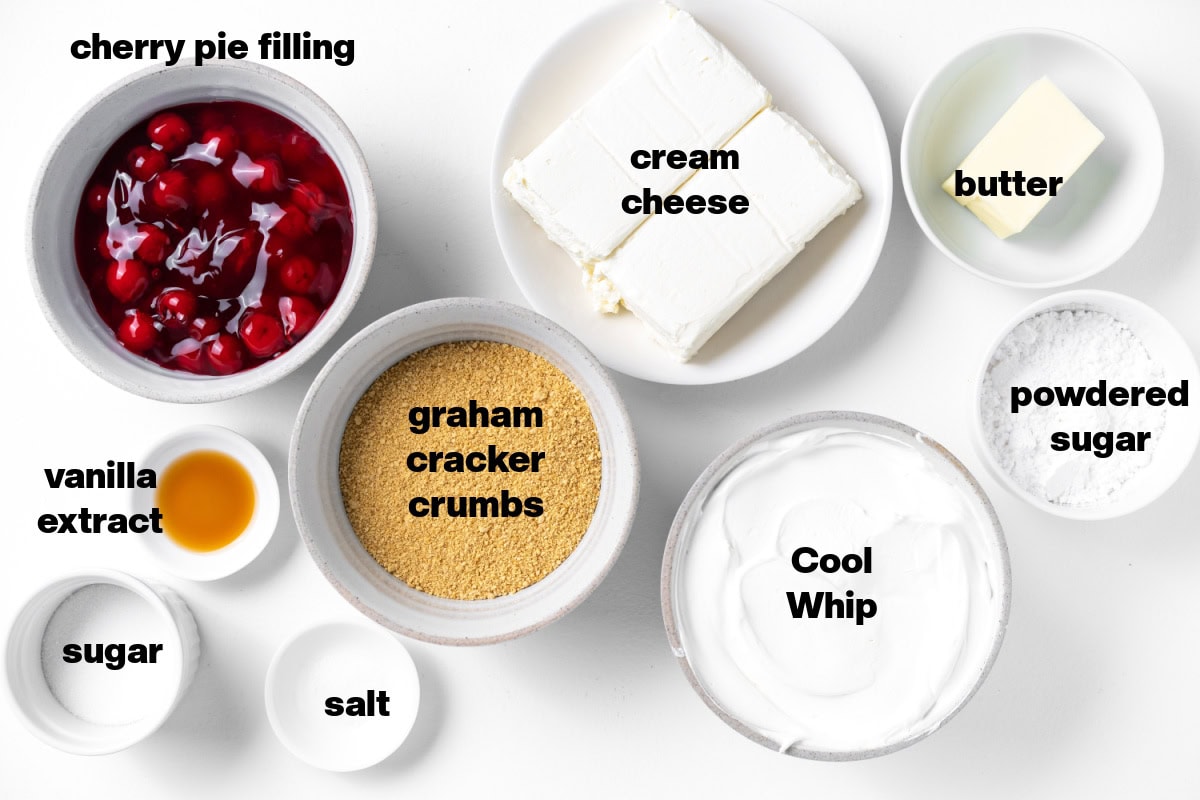 This easy No Bake Cherry Cheesecake has a buttery graham cracker crust, fluffy cream cheese filling, and sweet cherry topping. Perfect make-ahead dessert! ingredients displayed for making no bake cherry cheesecake