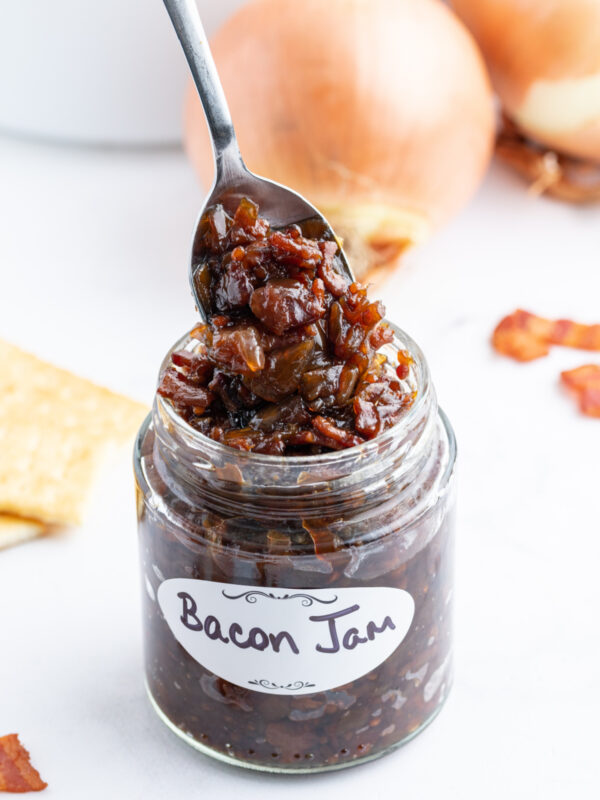spooning bacon onion jam out of jar