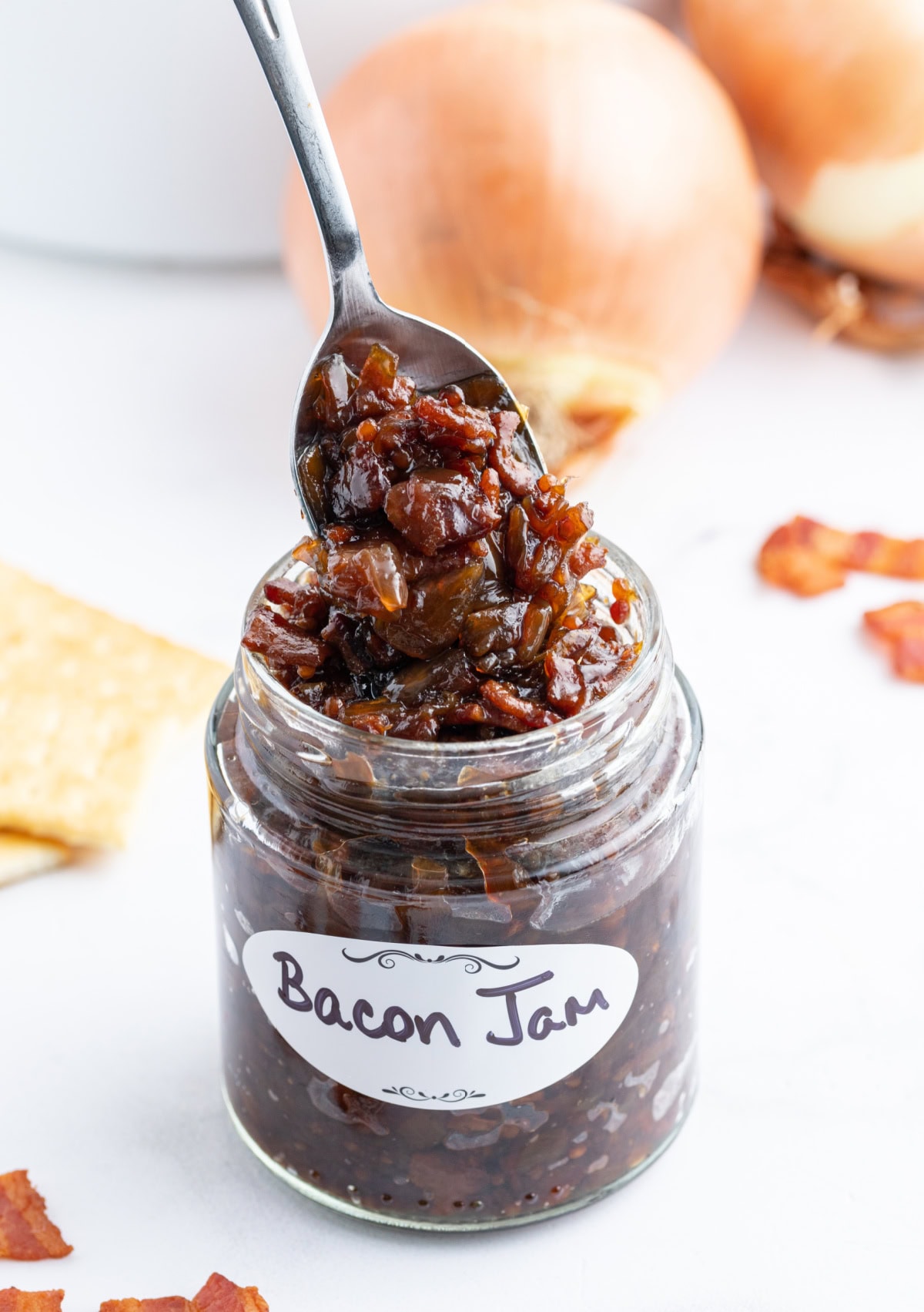 spooning bacon onion jam out of jar