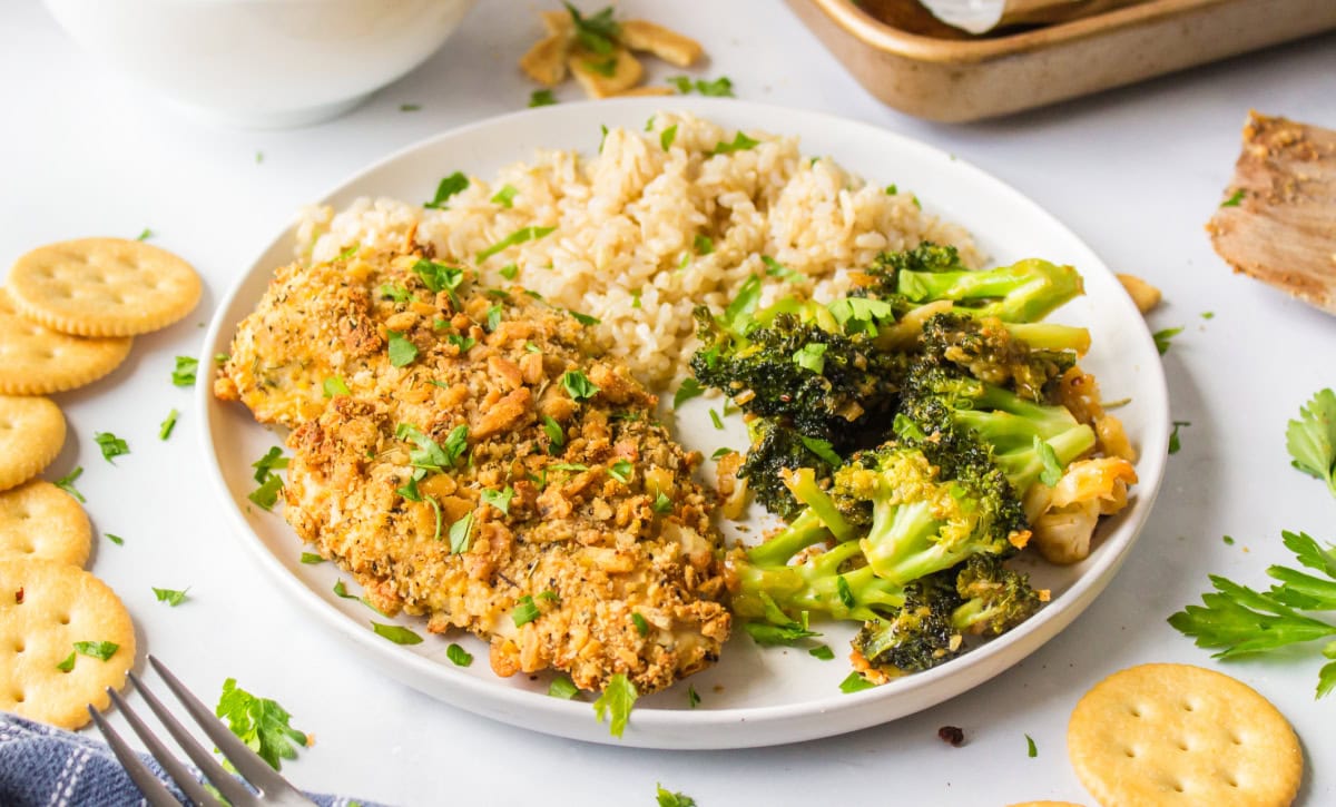 butter cracker chickemn served on plate with rice and broccoli