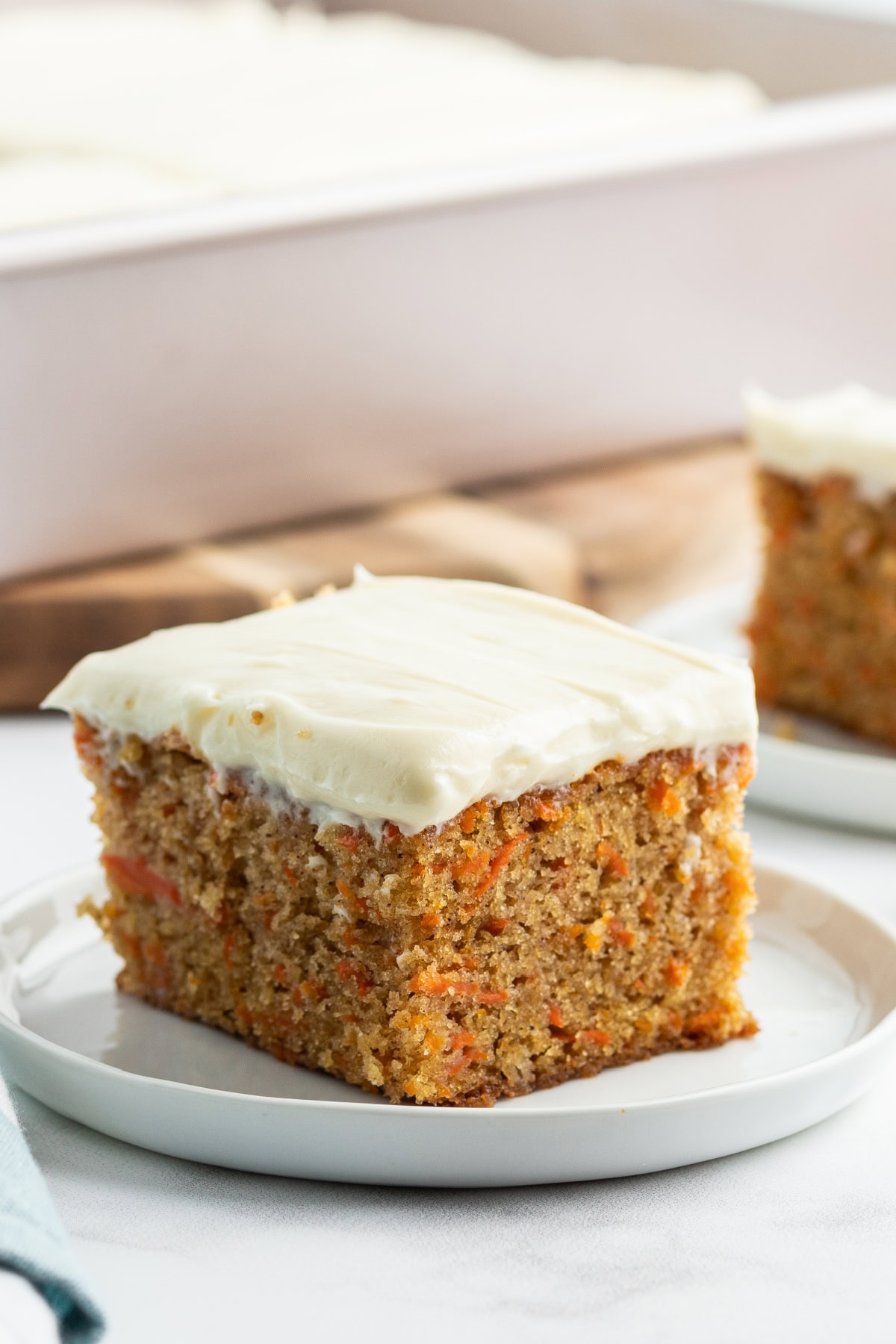 slice of carrot cake sheet cake on a plate