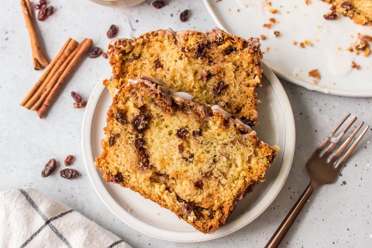 two slices of cinnamon bread with raisins on plate