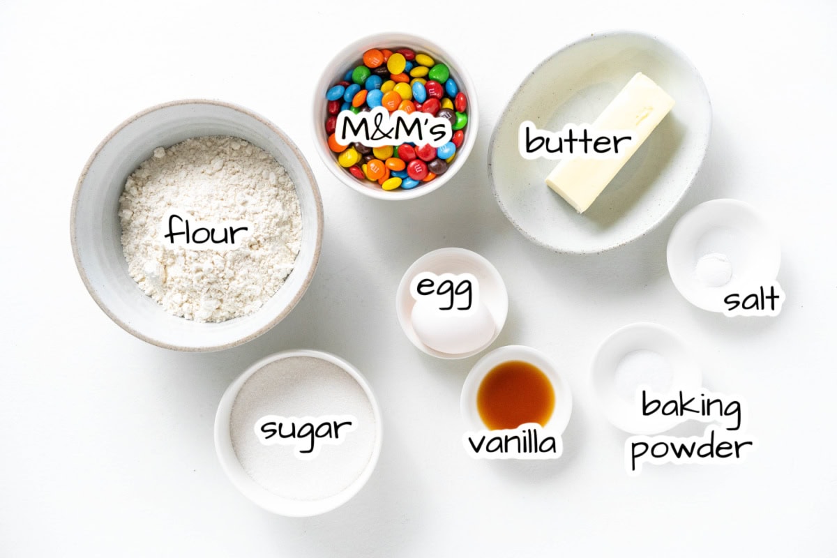 Giant M&M Cookies are soft, chewy and loaded with candy. A bakery-style cookie recipe you can easily make at home. ingredients displayed for making giant M&M cookies