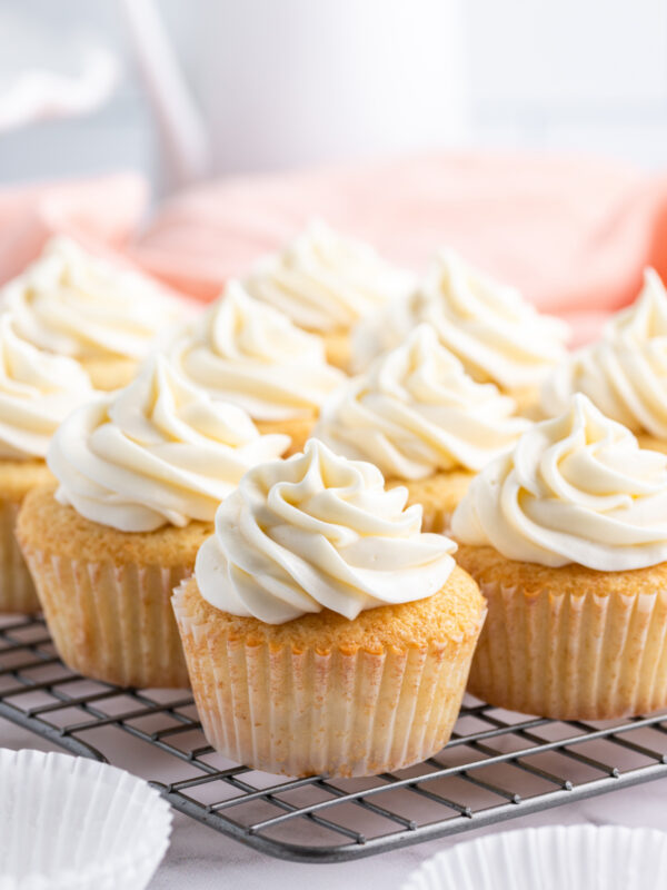 homemade vanilla cupcakes on a rack