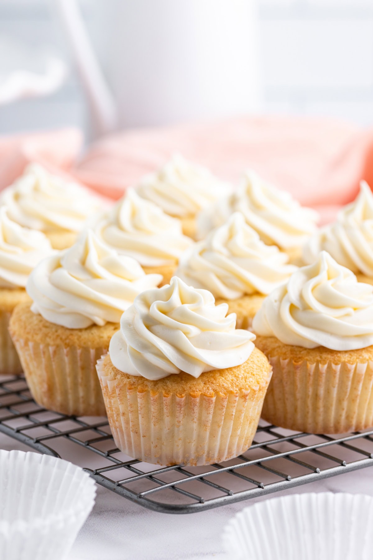 homemade vanilla cupcakes on a rack