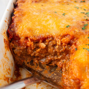 beef enchilada bake with piece cut out