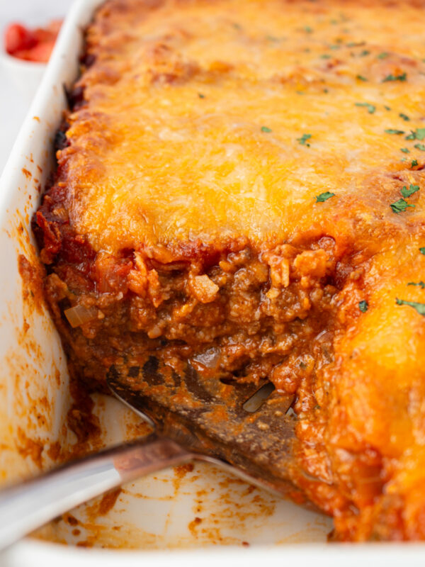 beef enchilada bake with piece cut out