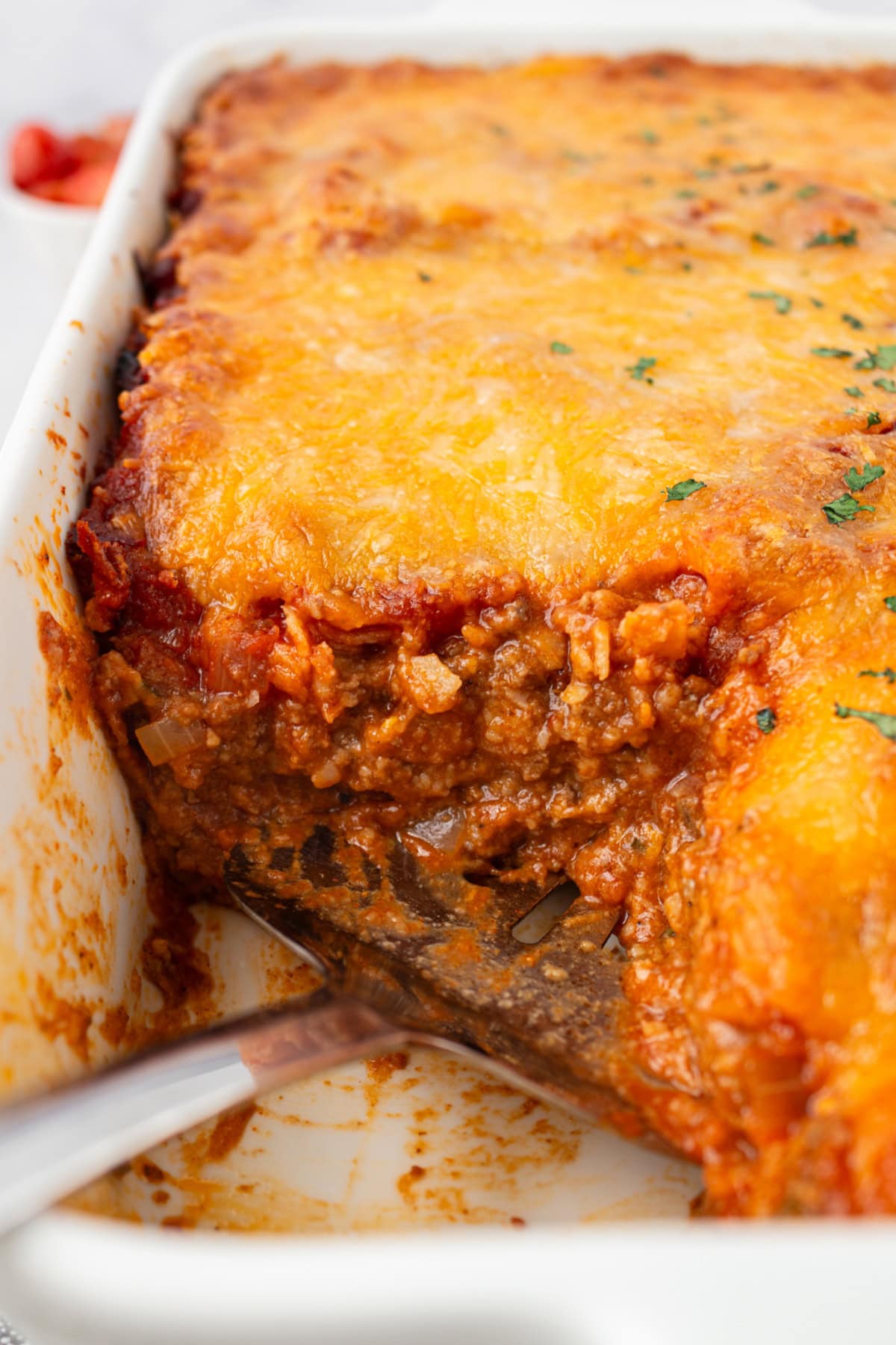 beef enchilada bake with piece cut out