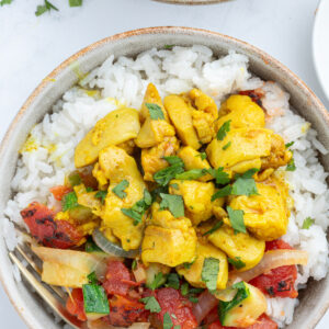 overhead shot of chicken curry bowls
