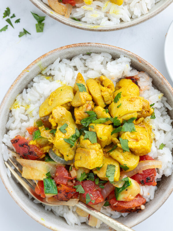 overhead shot of chicken curry bowls