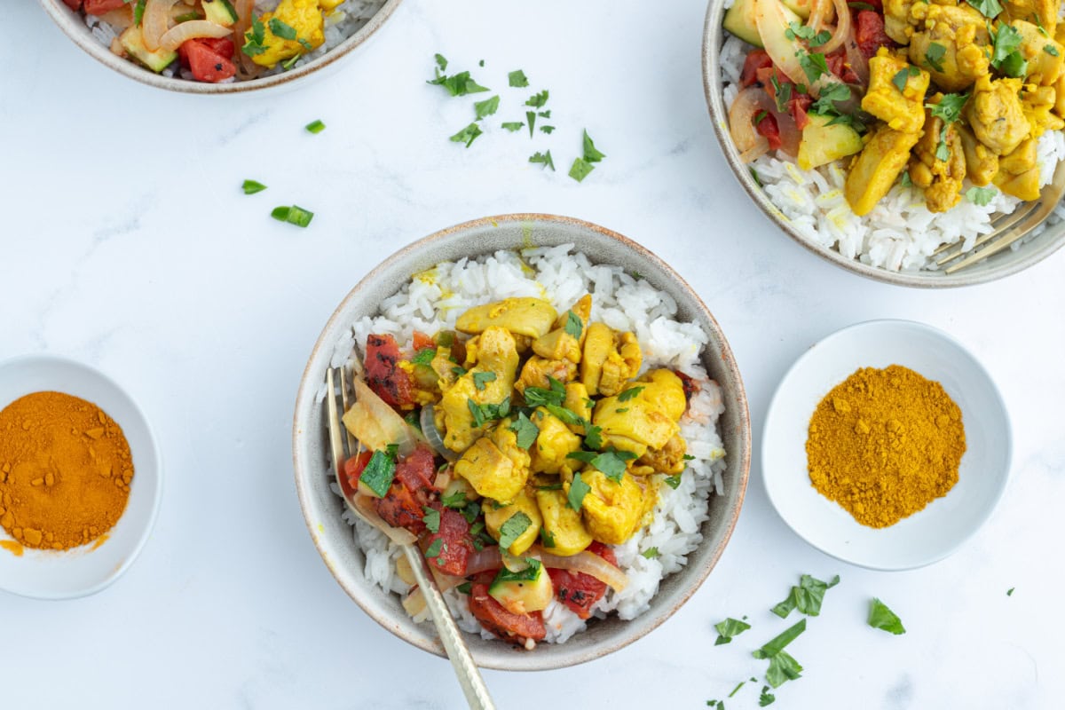 overhead shot of two servings of chicken curry bowls