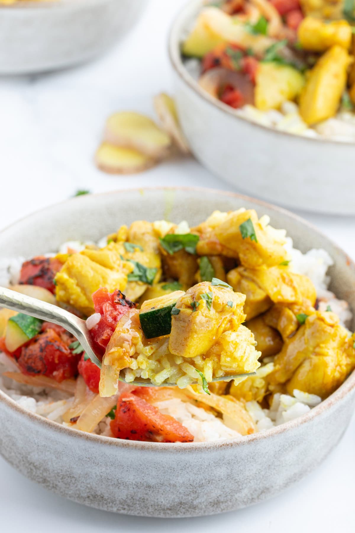 fork in chicken curry bowl