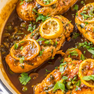 chicken with roasted lemons in skillet