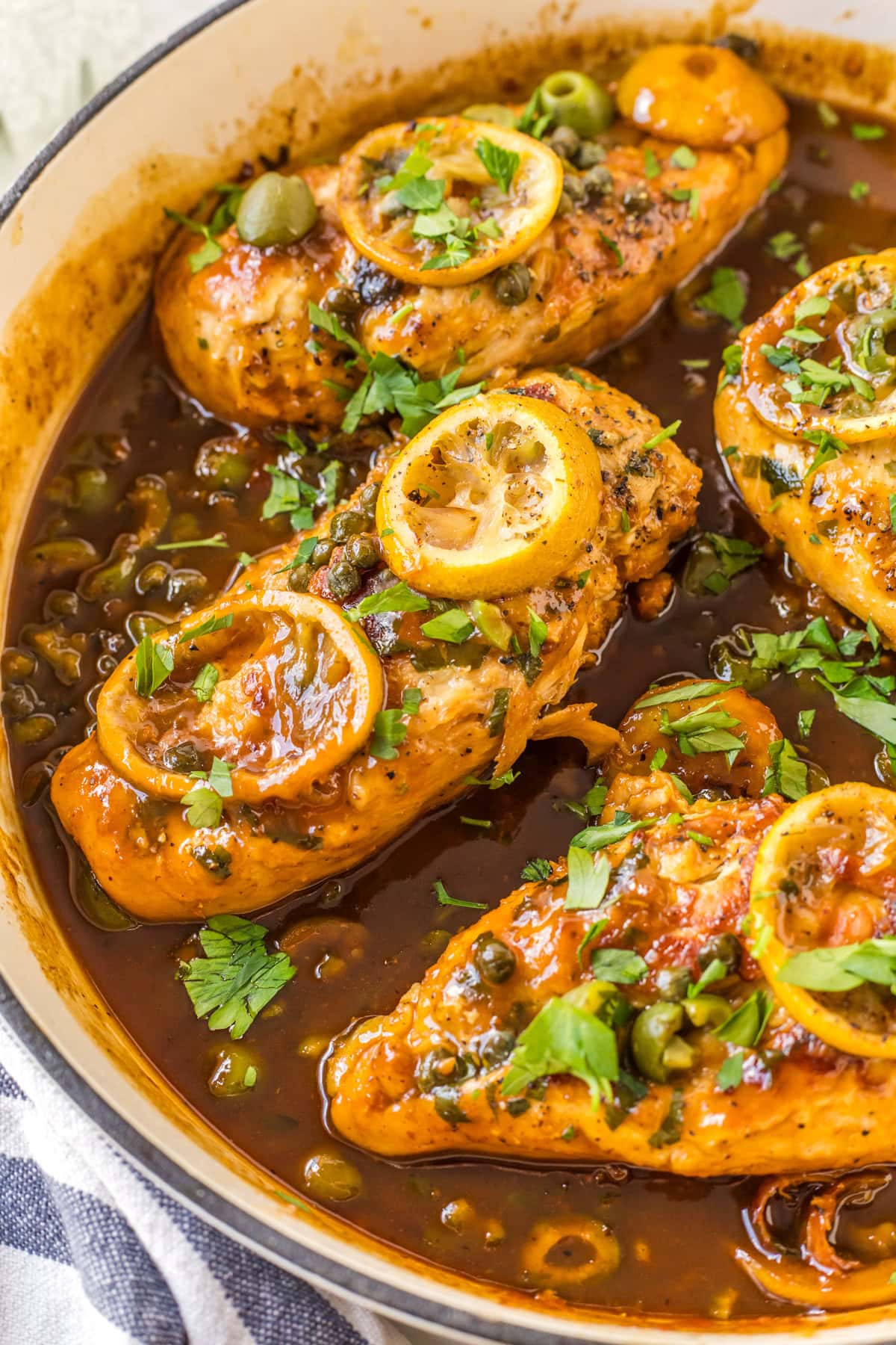 chicken with roasted lemons in skillet