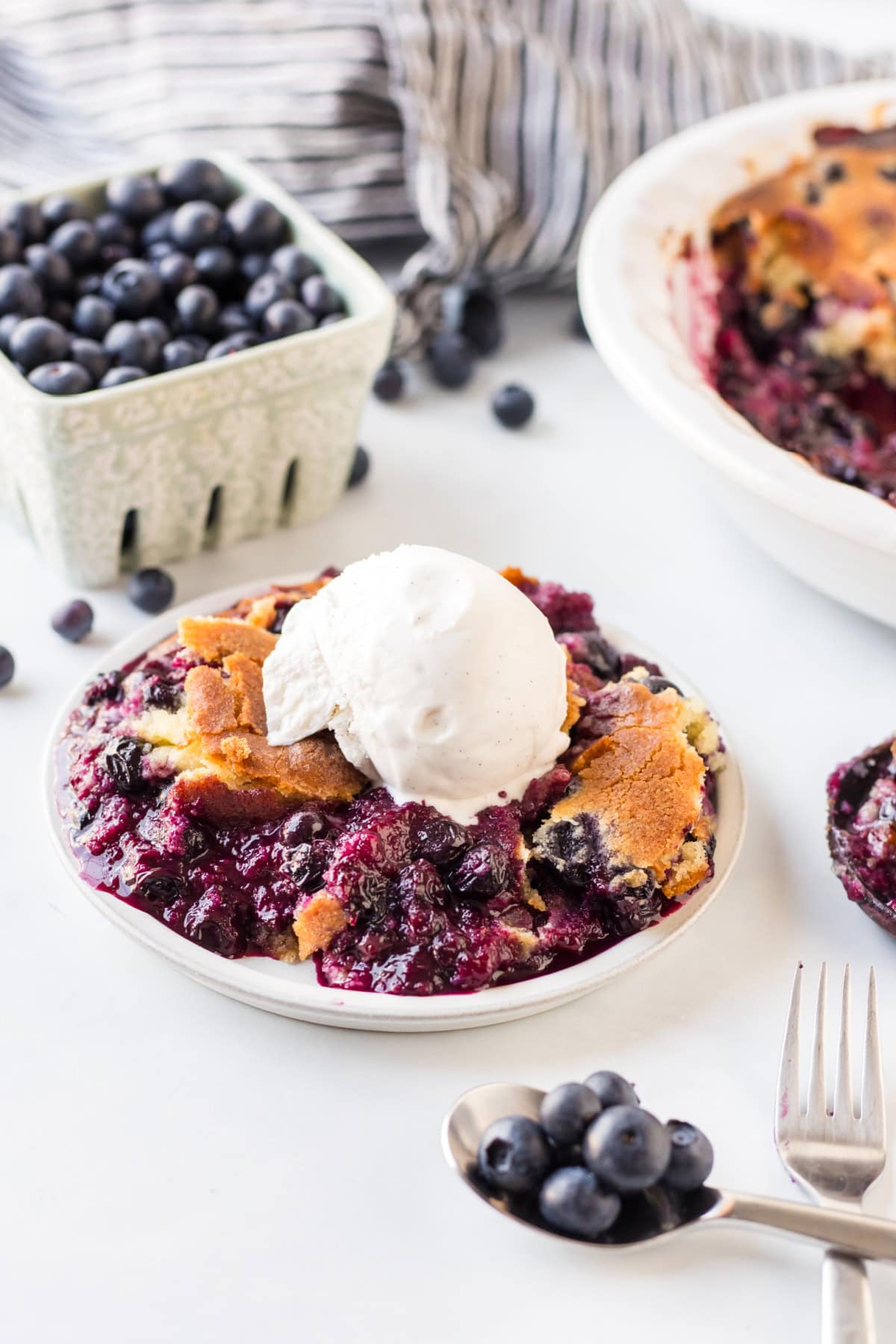 serving of easy blueberry cobbler with vanilla ice cream