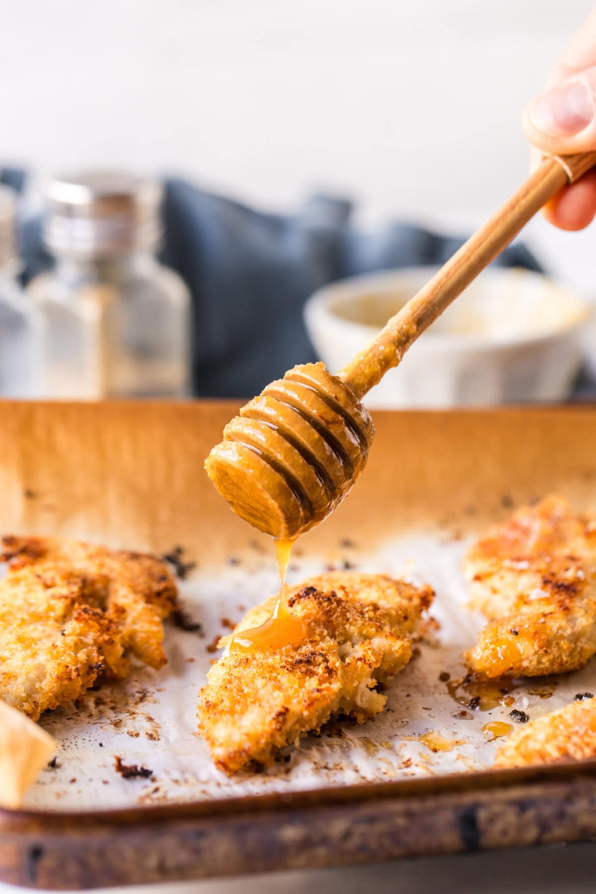 drizzling hot honey on baked chicken tenders