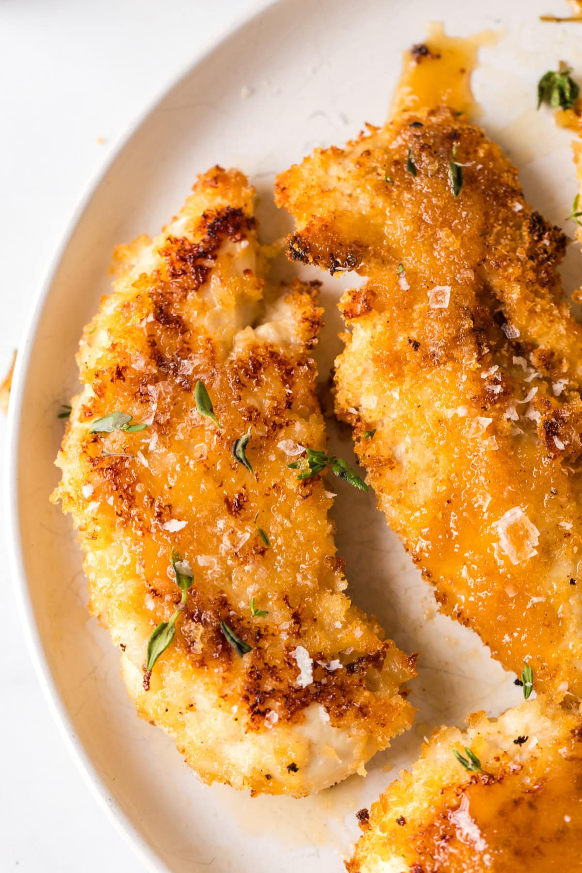 hot honey chicken tenders on white plate
