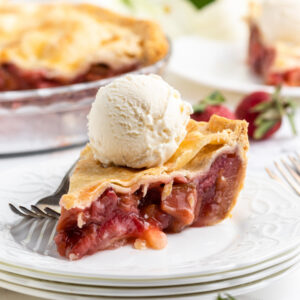 slice of strawberry rhubarb pie on a plate