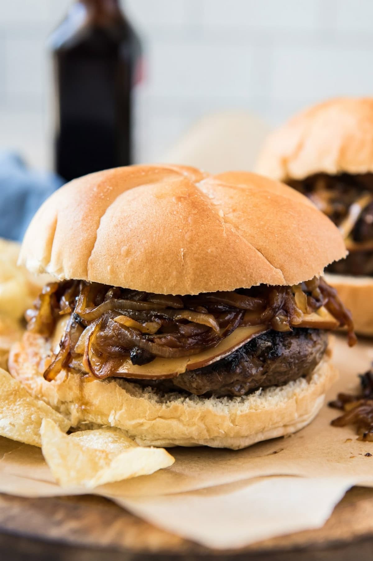 bacon bit burger with gouda and smothered onions
