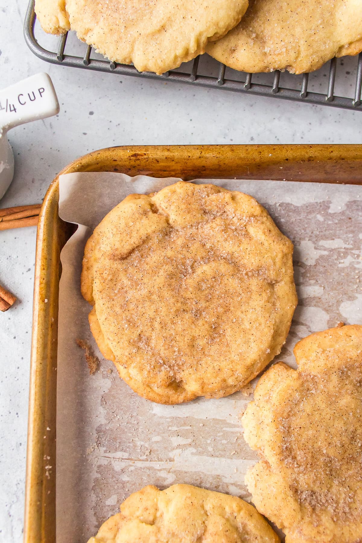 sugar and cinnamon cookies on a baking sheet