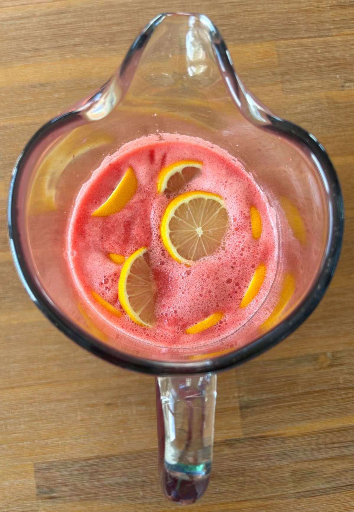 overhead shot of pitcher of watermelon strawberry lemonade