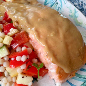 salmon on plate served with salad