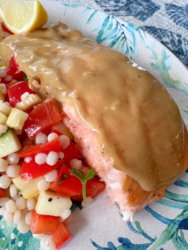 salmon on plate served with salad