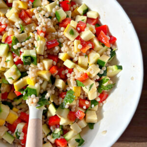 peek at half a bowl of summer couscous salad