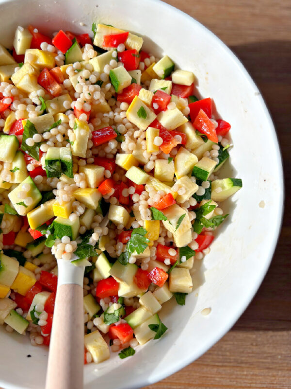 peek at half a bowl of summer couscous salad