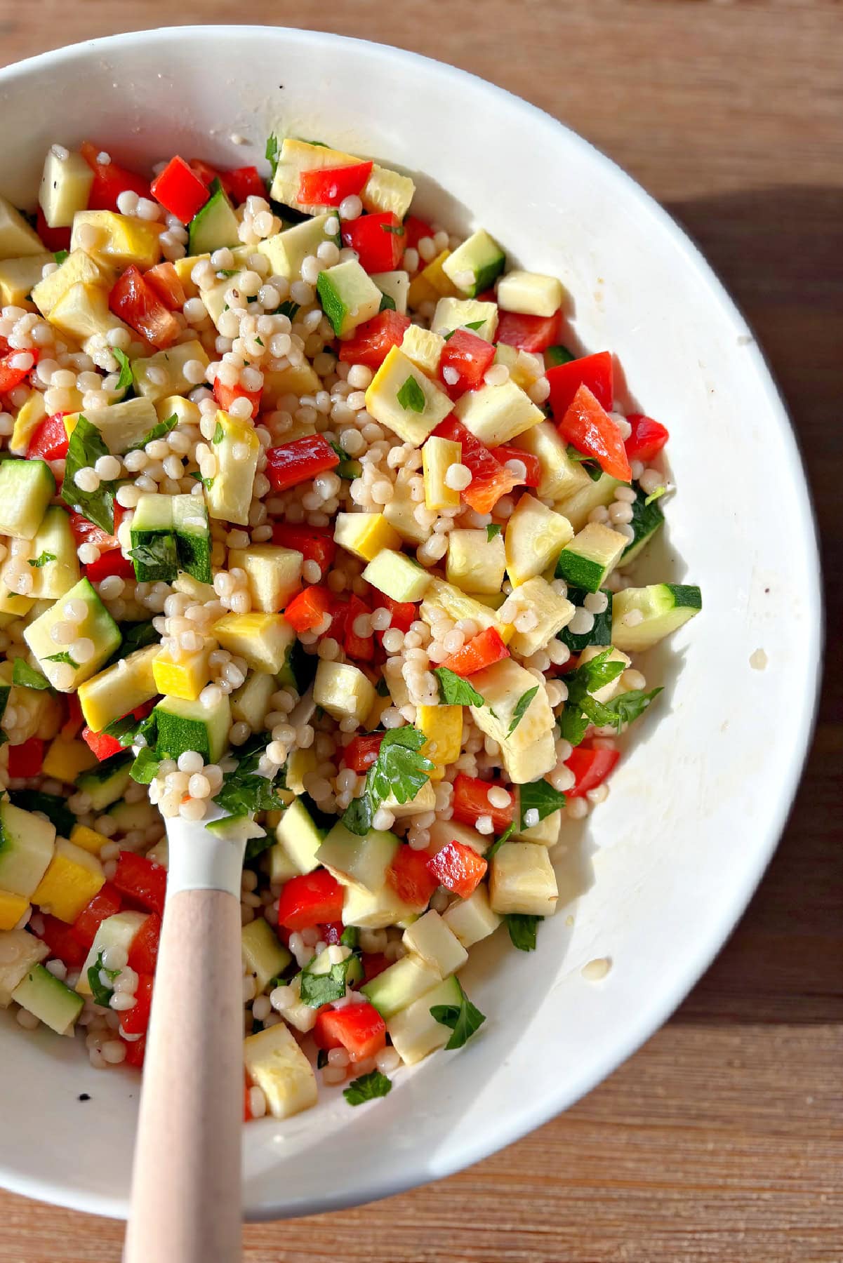 peek at half a bowl of summer couscous salad